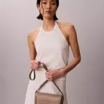 Calvin Klein Embossed Monogram Beige Saddle Bag for Women