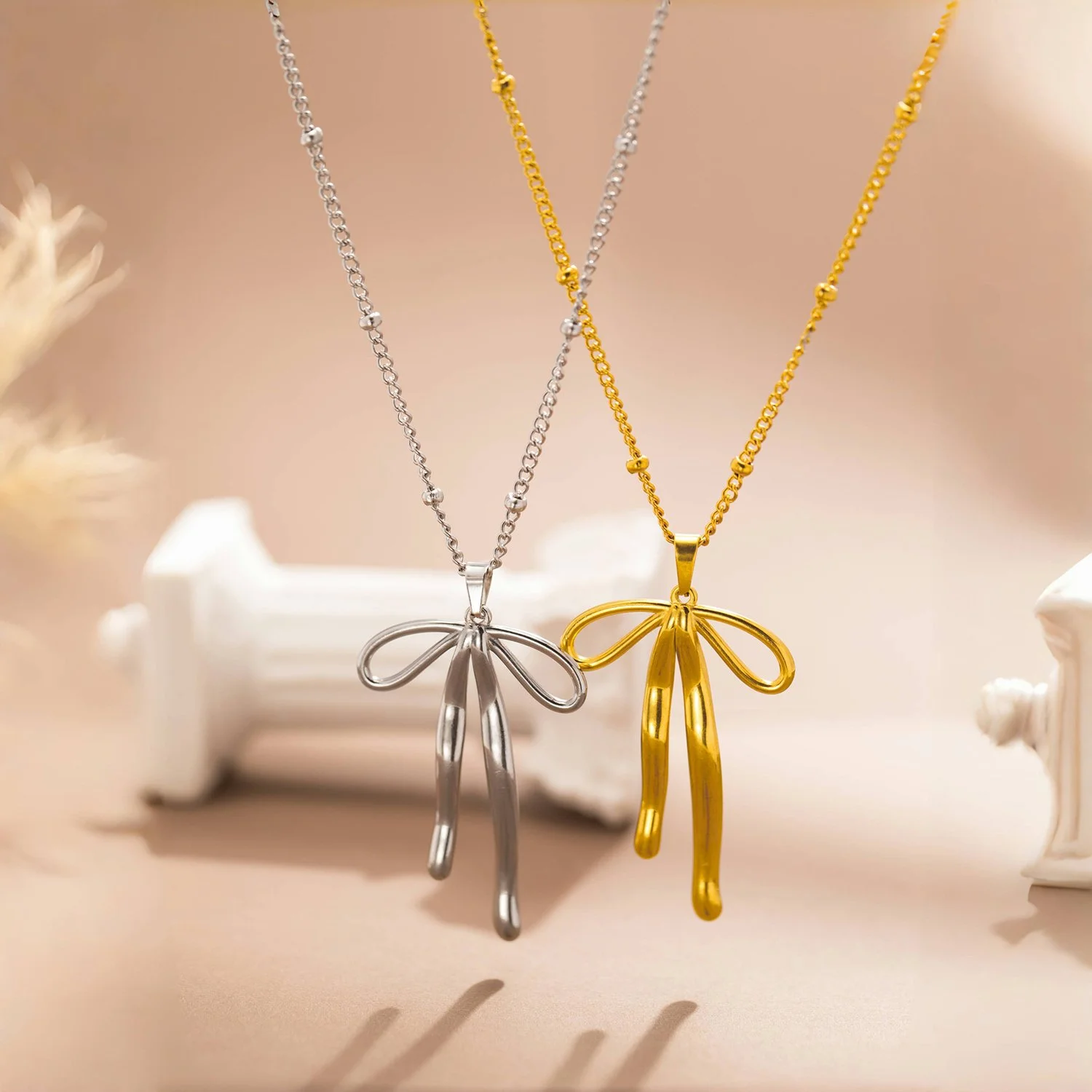 Stainless Steel Bowknot Pendant Necklace – Waterproof Gold-Plated Elegance